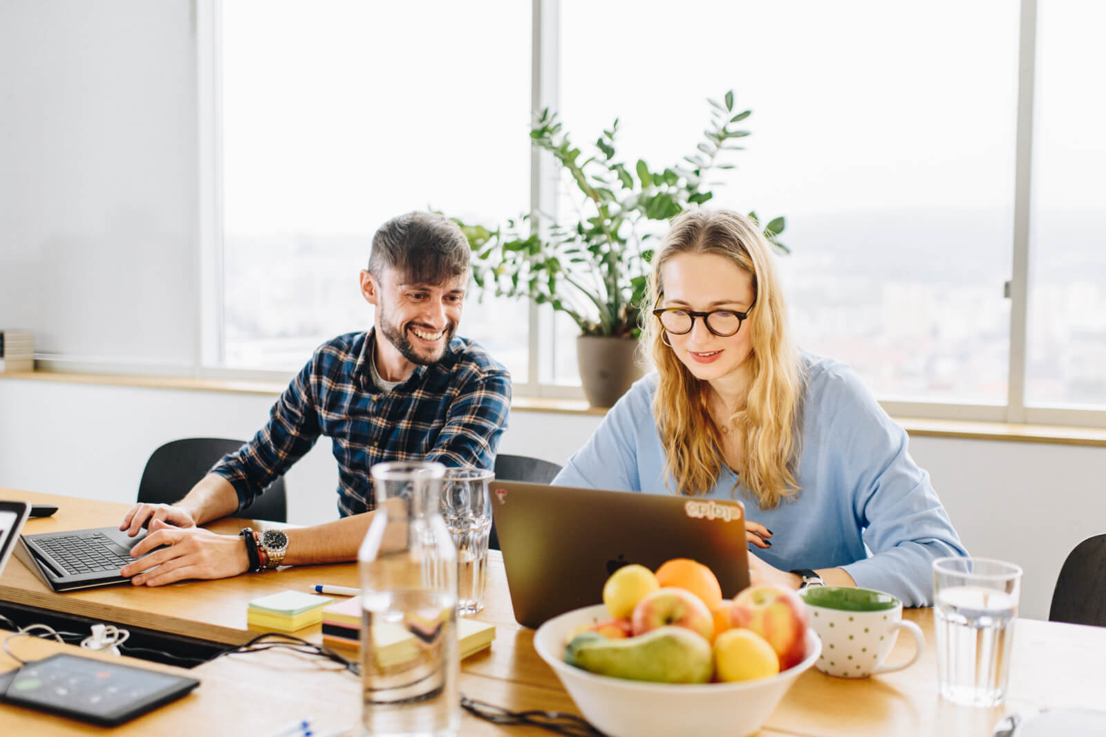 Image of two Slido colleagues at a meeting