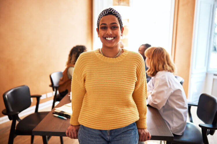 a picture of a young female professional hosting a meeting